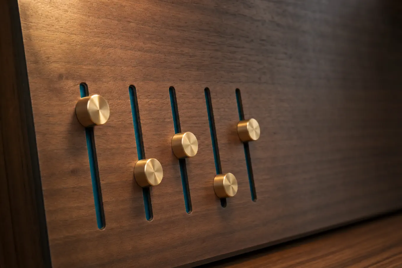 Five slider controls on a walnut panel set to different positions